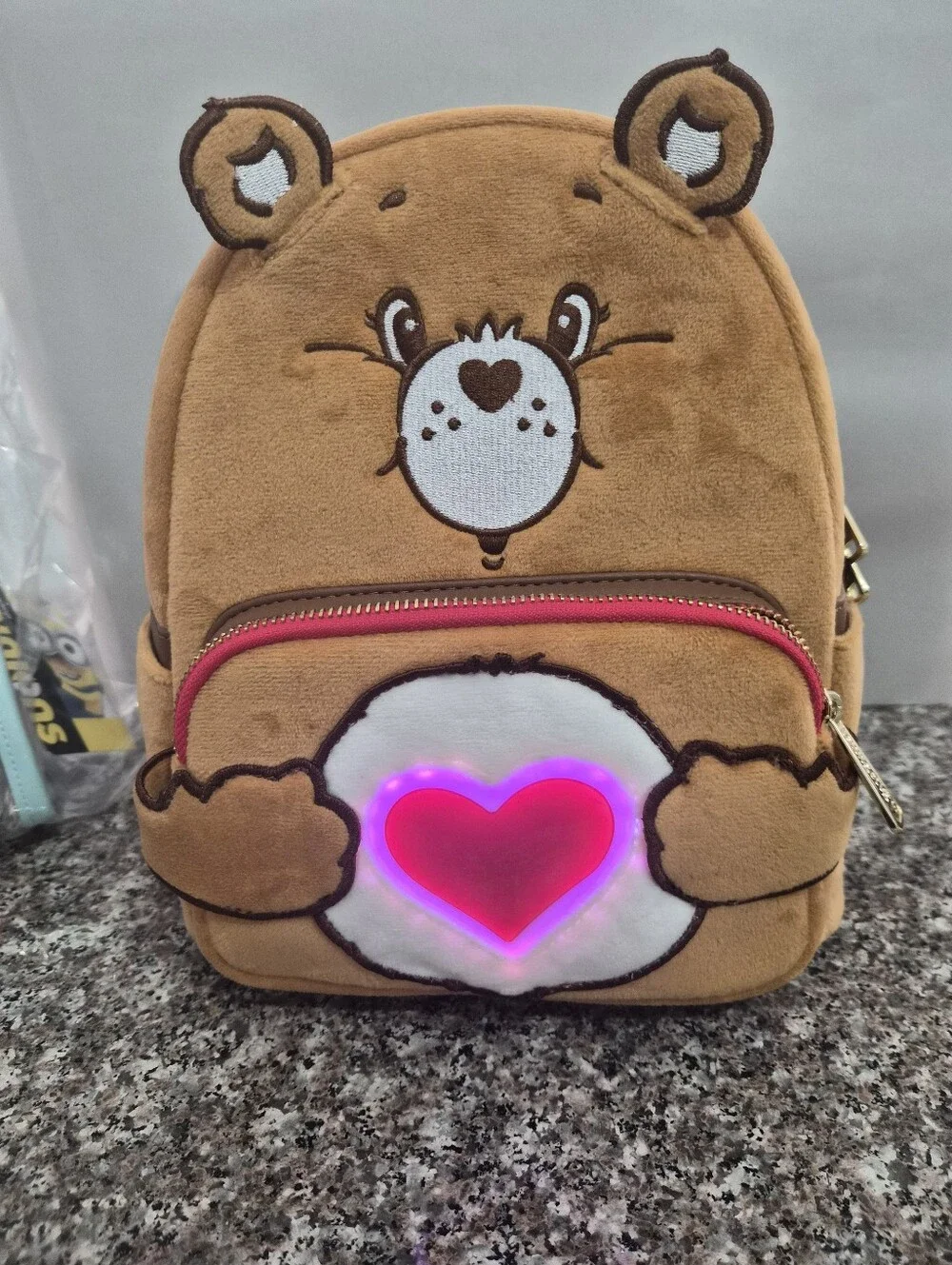 Loungefly Care Bear Plush Backpack with Pink Ligh Up Heart.